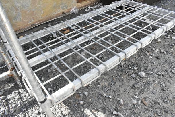 Metro chromed 4-tier wire shelving, pre-owned, visible rust. Buyer dismantles for freight. Sturdy construction.