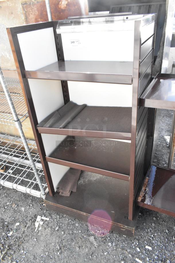 Two metal merchandising display racks, each with three shelves, brown frame, and white backing. Slight wear visible.