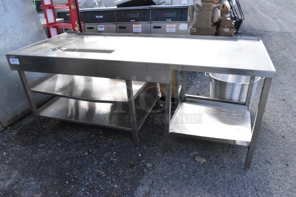 Stainless steel soda station with two under shelves, used condition. Features a flat work surface and durable construction.