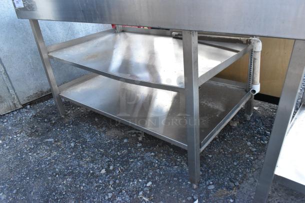 Stainless steel soda station with two under shelves, sturdy frame, minor surface scratches, suitable for commercial use.