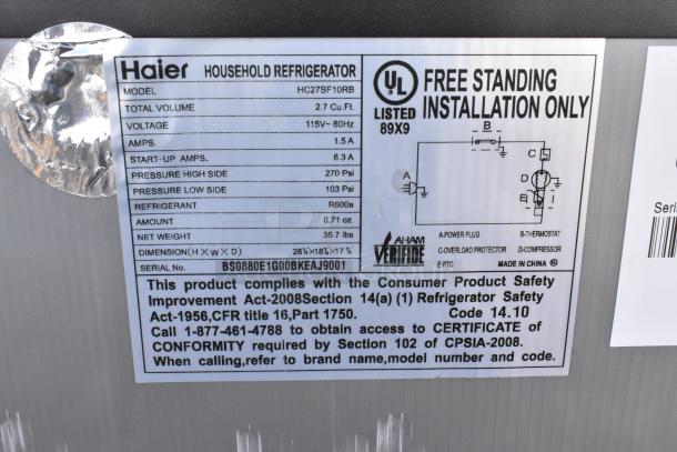 Label on Haier mini cooler model HC27SF10RB, 2.7 cu. ft., 115V, made in China, UL listed, with safety compliance details.