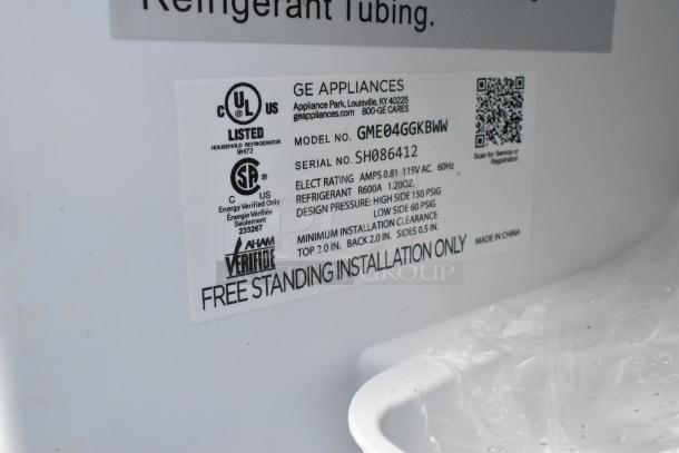 Label on GE GME04GGKBWW mini cooler, showing electrical rating, model, serial number, and installation instructions.