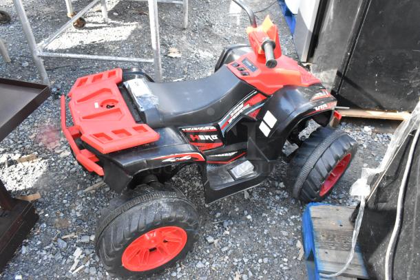 Hero No Fear children's ATV, black and red, in used condition. Features include large wheels and hand grips; labels show branding.