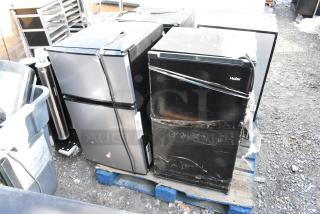 Four mini coolers on pallet, including Haier HC33SW20RB; 115 volts, 1 phase. One shows visible wear. All wrapped with plastic.