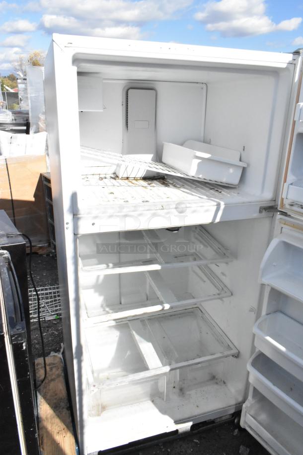 Maytag M1TXEGMYW01 reach-in cooler with freezer, 115V, 1 phase. Visible wear, interior shelves, needs cleaning.