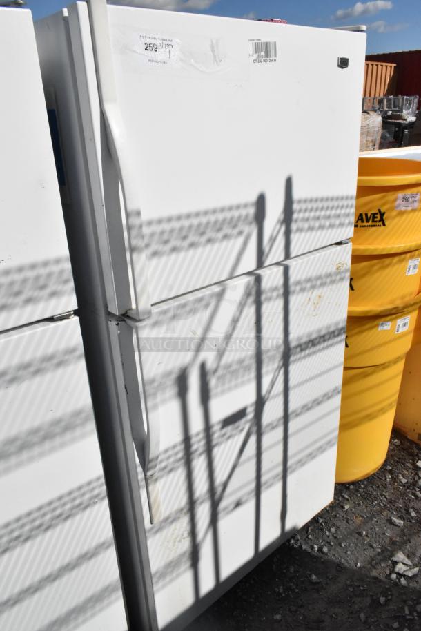 Maytag single door reach-in cooler with freezer, 115 volts, 1 phase, visible exterior wear, barcode and label stickers present.