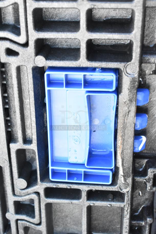 Orbis black poly bin, sturdy design, blue handle with embossed logo, model M6189, signs of light use visible.