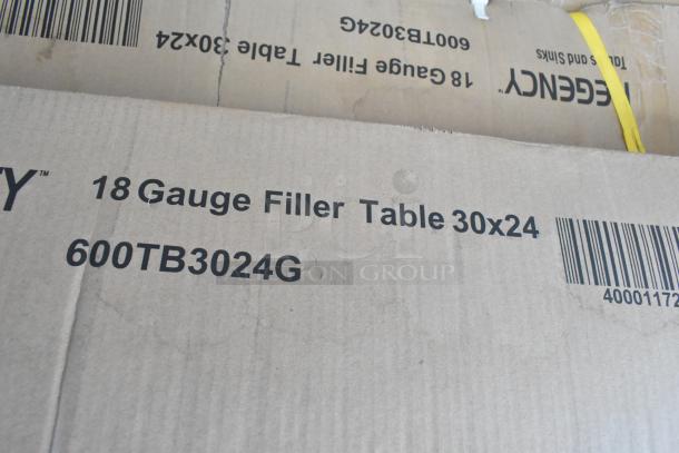 Cardboard box labeled "18 Gauge Filler Table 30x24, 600TB3024G," indicating new Regency stainless steel table.