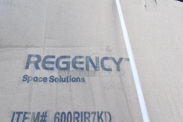 Cardboard box marked "Regency Space Solutions" showing item number 600RIR7KD; part of a scratch and dent sale.