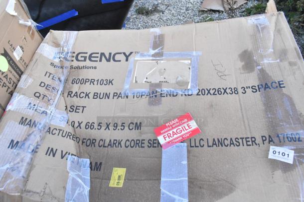 Cardboard box displaying markings for Regency 10 Pan End Load Rack, item 600PR103K. Features "Fragile" label.
