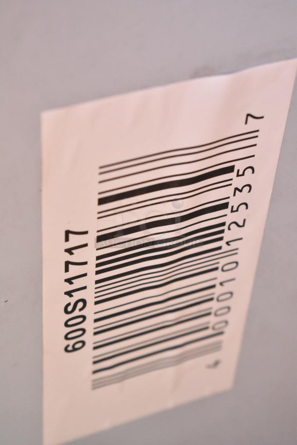 Barcode label on a scratch and dent auction item, with code 600S11717 and number 00010125357.