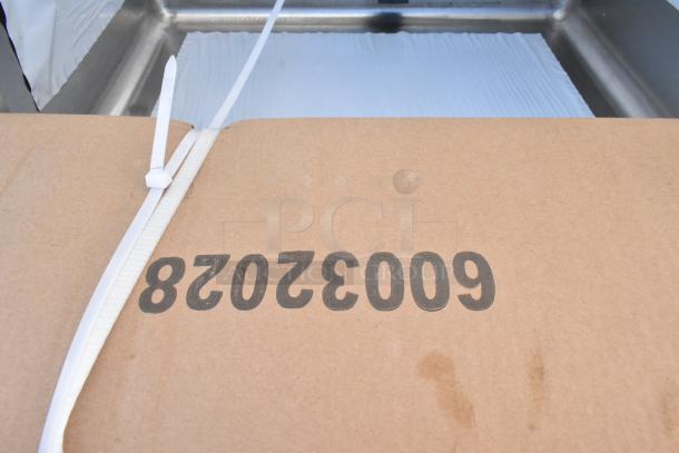 Brand new Regency Spec Line 3-bay stainless steel sink with dual drain boards; marked as scratch and dent. Box label: 60032028.