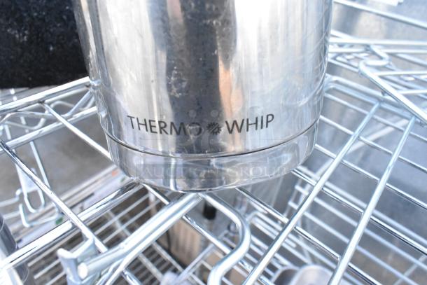 Chrome 3-tier wire shelving with metal baking pans, showing "THERMO WHIP" labeled canister. Buyer to dismantle.