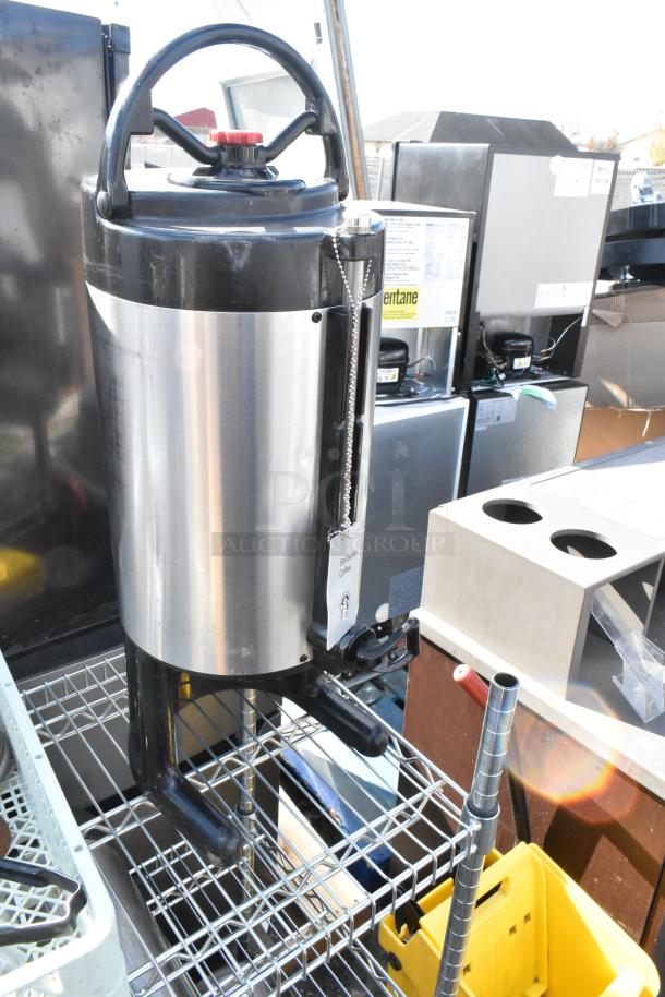 Chrome finish 3-tier wire shelving unit with contents, includes stainless steel tanks. Buyer must dismantle.