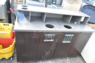 Commercial trash can shell with deposit holes and doors, mounted on casters. Includes labels for sorting waste. Used condition.