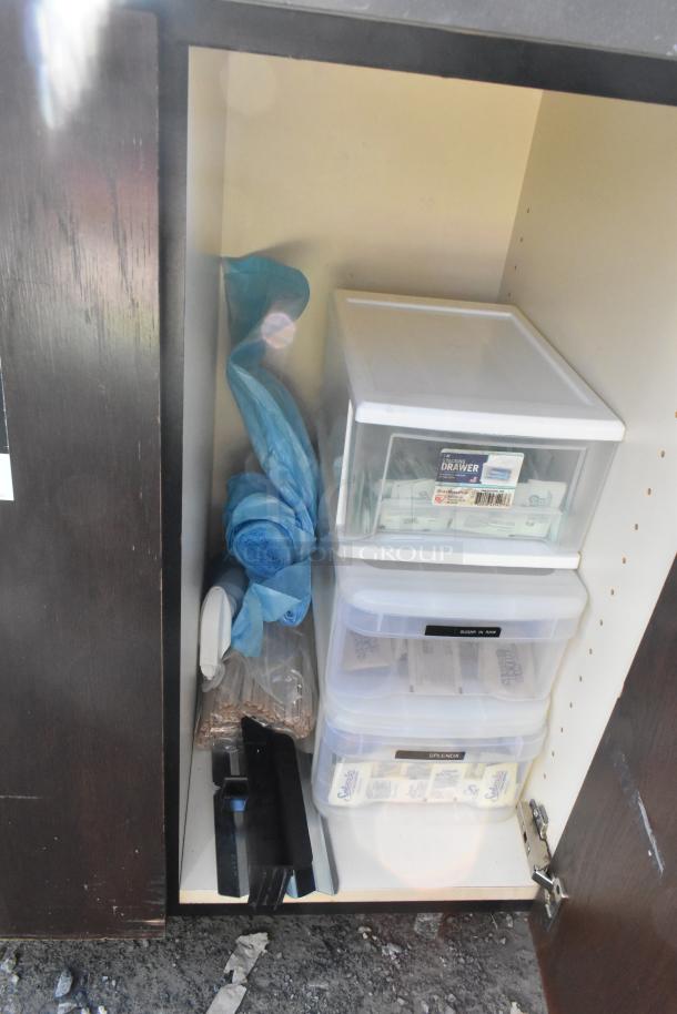 Commercial trash can shell with deposit holes, doors, and casters. Inside view shows storage containers and supplies.