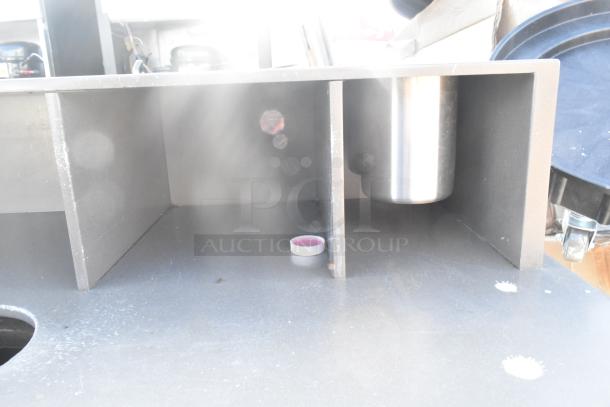 Trash can shell with deposit holes and doors, mounted on commercial casters. Visible compartments and metal insert.