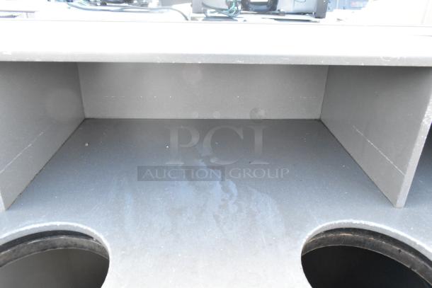 Trash can shell with deposit holes, equipped with doors on commercial casters. Good condition, ideal for waste management.