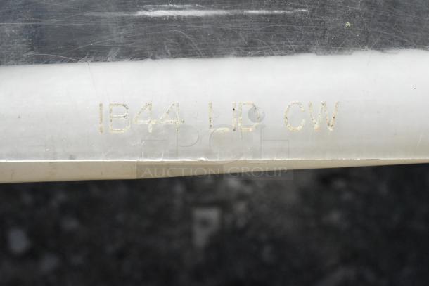 White poly ingredient bin with marking "IB44 LID CW" on the side.