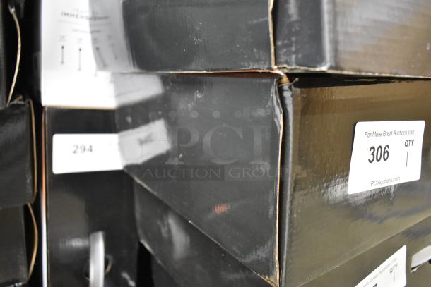 Black boxes with stickers for auction lot items, showing slight wear and scratch marks on corners.