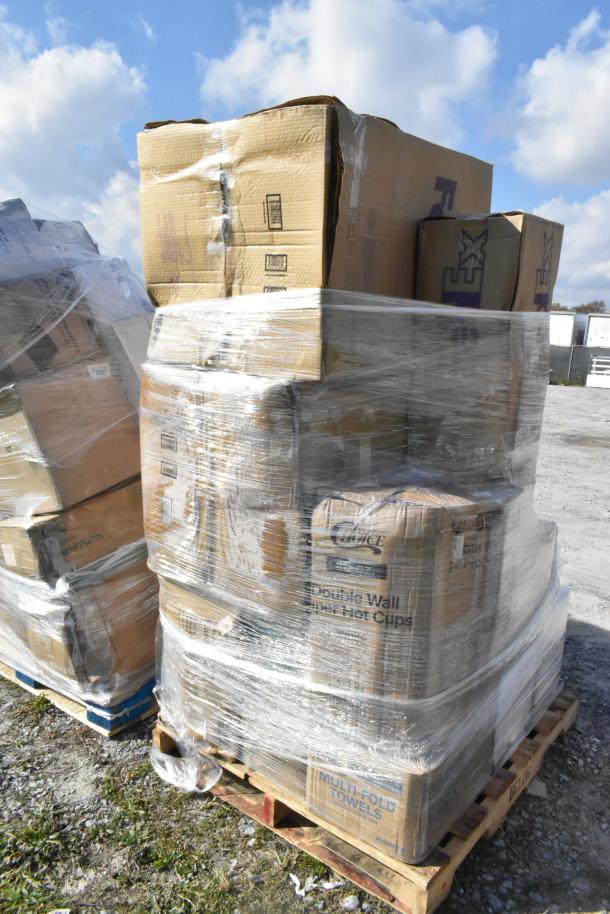 Shrink-wrapped pallet of 14 new scratch and dent items, including towels, cups, plates, and gloves, in cardboard boxes.