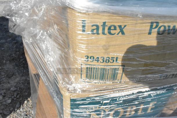 Pallet wrapped in plastic, containing boxed items labeled "Latex" with code 394385L. Auction lot includes diverse new items.