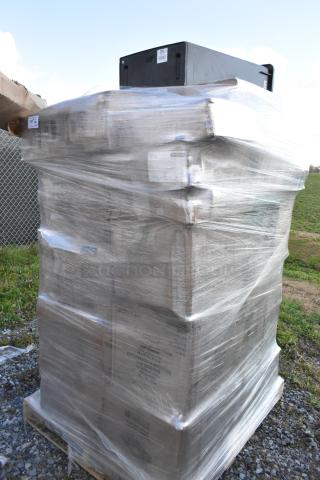 Pallet of 34 scratch and dent items, shrink-wrapped, including containers, Depends, can liners, and paper towels.