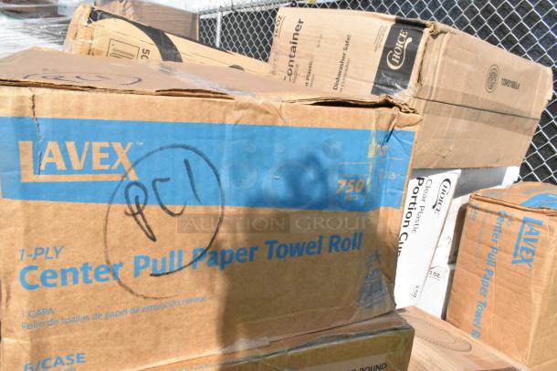 Boxes labeled Lavex and Choice containing new scratch and dent items like paper towels and plastic cups.