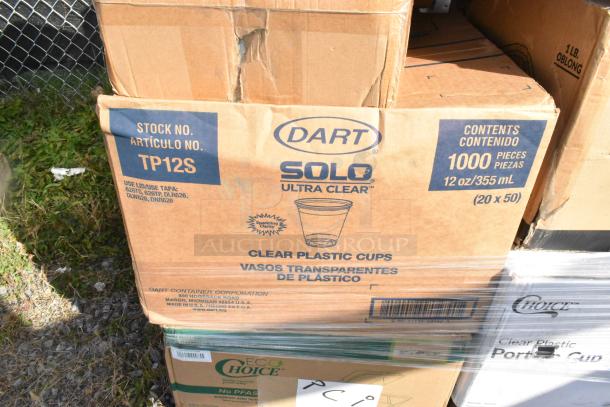 Cardboard box of Dart Solo Ultra Clear plastic cups, 12 oz, 1000 pieces, stock no. TP12S. Box shows minor damage.