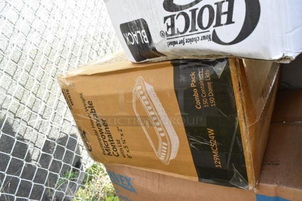 Boxes containing scratch and dent items, including Choice microwavable containers and other household goods.