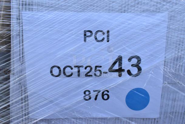 Packaged lot labeled "PCI OCT25-43, 876." Contains containers, towels, toilet paper, gloves, can liners. Scratch and dent items.
