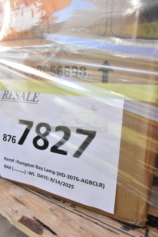 Auction lot with 28 new scratch and dent items, includes wine glasses and burger press. Tag: Hampton Bay Lamp (HD-2076-AGBCLR), date 8/14/2025.