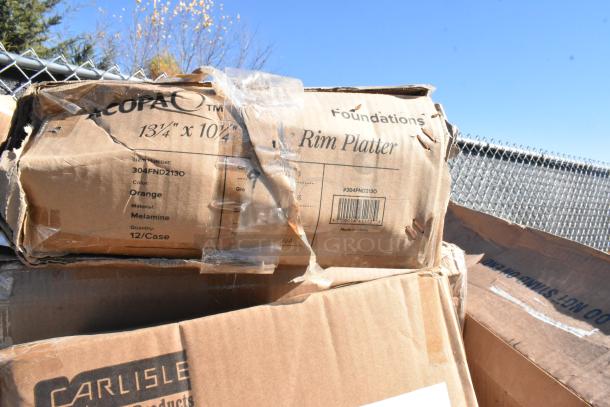 Cardboard boxes labeled as Carlisle Rim Platter, item number 304FND2130, 13¾" x 10½", orange melamine, 12 per case.