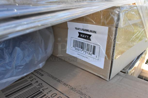 Cardboard box labeled "164CUSHMLNVN, Navy," showing barcode and "Made in Malaysia." Part of new scratch and dent auction lot.