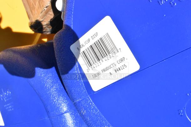 Blue Igloo 5-gallon beverage cooler with label showing barcode and product details. Scratch and dent condition.