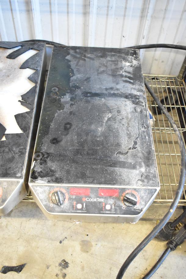 CookTek MC2502F commercial induction range, featuring a metal body with dual burners, one with a broken glasstop. 200-240 volts.