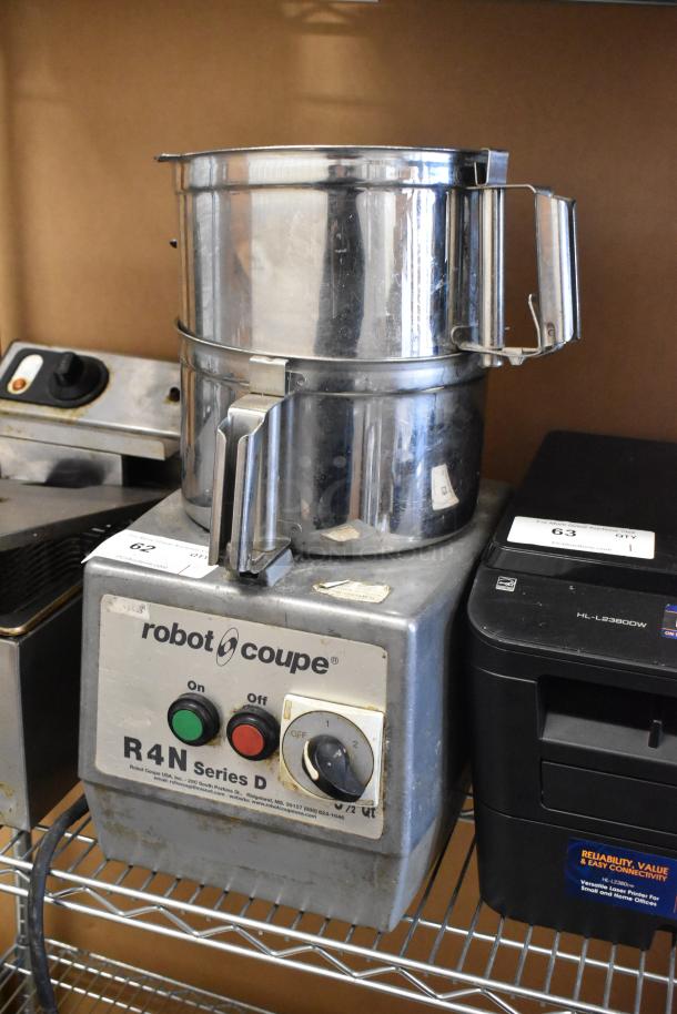 Robot Coupe R4N metal food processor with two bowls and S blade, 220V, 3-phase, visible wear, control dial, power switches.