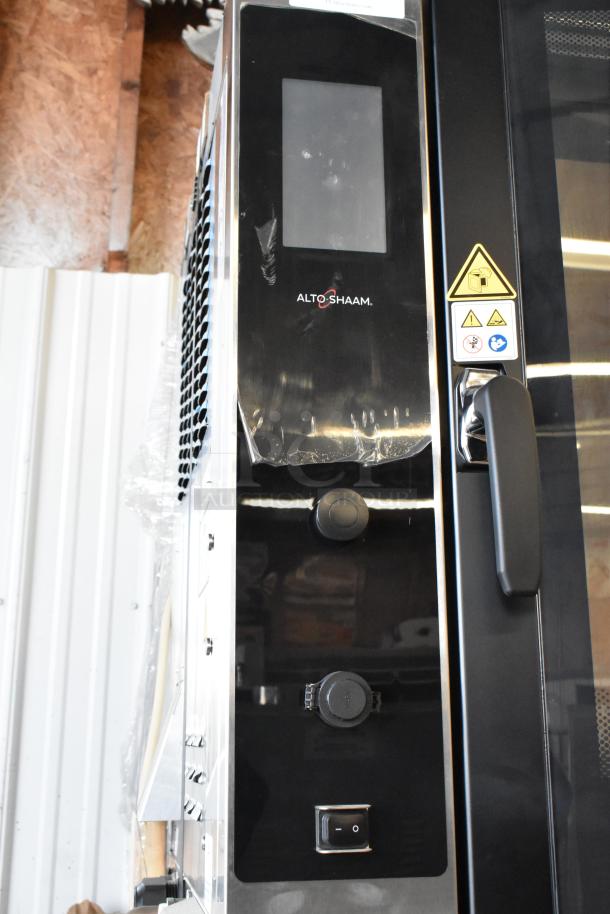 Brand new 2022 Alto Shaam AR-7T stainless steel rotisserie oven, 380-415V, 1-phase, in original packaging, control panel view.
