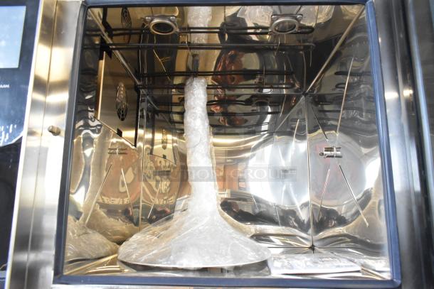 Brand new Alto Shaam AR-7T rotisserie oven with 7 spits, stainless steel, 380-415V, 1 phase, with protective wrap inside.