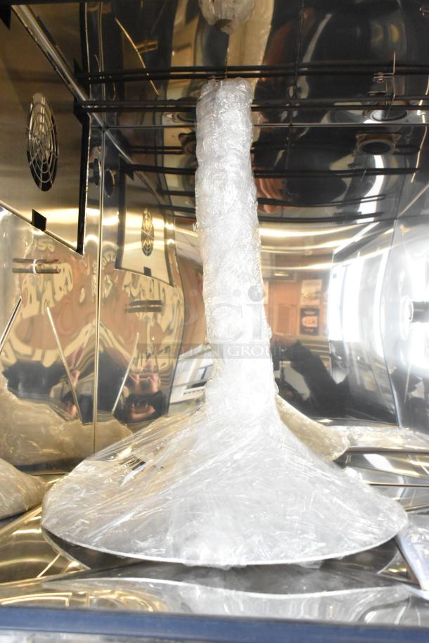 Brand new 2022 Alto Shaam AR-7T stainless steel commercial rotisserie oven, wrapped in protective plastic, for auction.