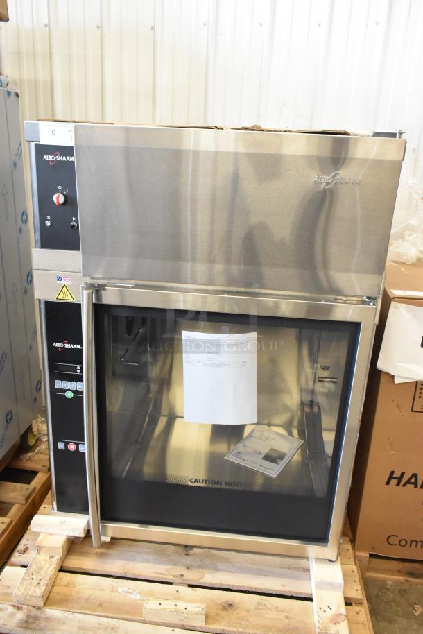Brand new Alto Shaam AR-7EVH stainless steel rotisserie oven, 240V, 1 phase, in box. Features control panel, glass door.