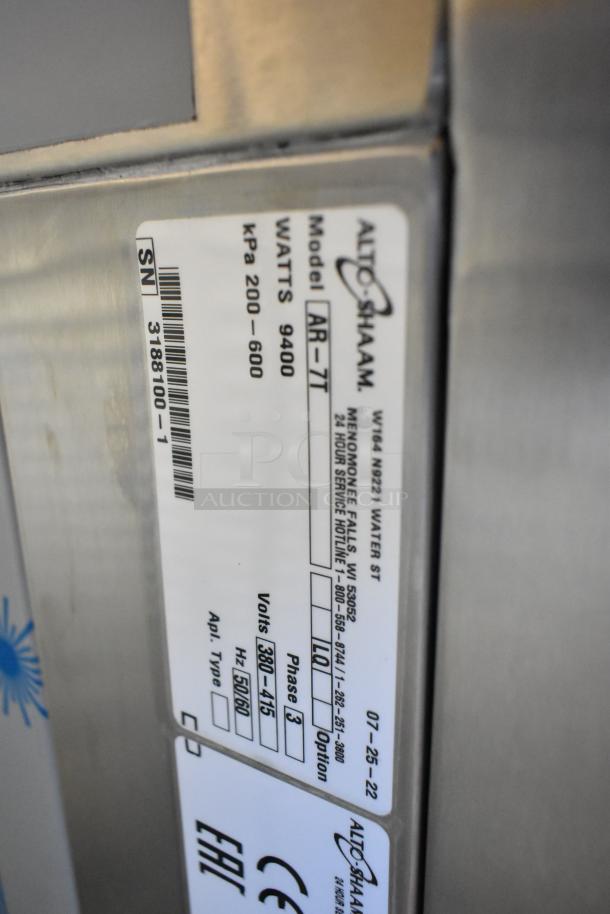 Brand new Alto Shaam AR-7T rotisserie oven. Stainless steel, 380-415V, 1 phase, 7 spit, commercial use, model tag shown.