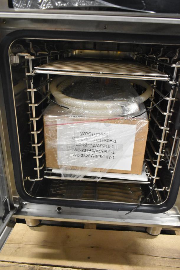 Brand new Alto Shaam CTX4-10E stainless steel combi oven, features include boilerless design. Includes wood chips pack.