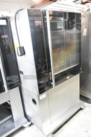 Fri-jado TDR7-P Stainless Steel Commercial Floor Style Electric Powered Rotisserie Oven on Commercial Casters. 208 Volts, 3 Phase. - Item #1192935