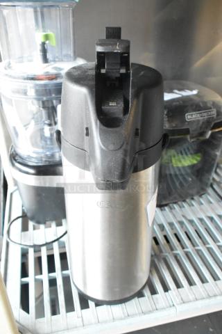 CAC stainless steel air pot with black lid, used condition, capacity markings visible on side, ideal for hot beverages.
