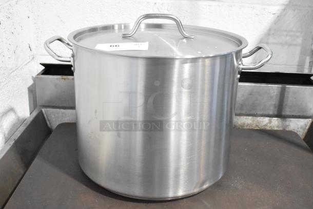 Alt Text: Vigor 32 Qt. heavy-duty stainless steel stock pot with aluminum-clad bottom, brand new with minor scratches.