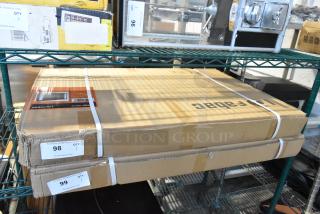 Brand new Fabac XIL-2436R lighted mirror in original packaging on shelf; scratch and dent noted.
