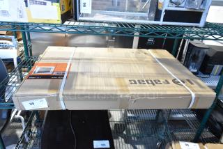 Brand new Fabac XIL-2436R lighted mirror in original packaging, marked as scratch and dent. Box shows minor wear.