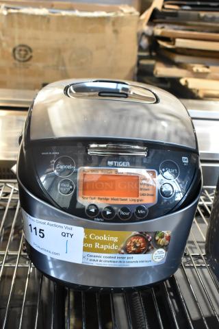 Tiger JKT-D18U countertop rice cooker, 120 volts, 1 phase, ceramic coated inner pot, various cooking settings, good condition.