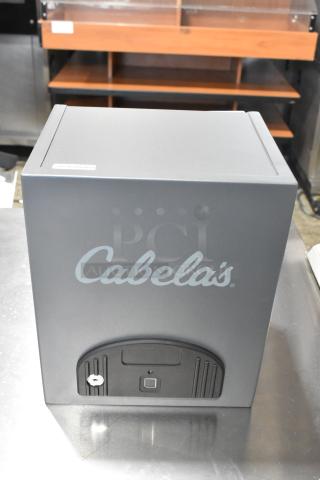 Cabela's gray metal box, secure locking mechanism, Cabela's logo, excellent condition. Suitable for storage or valuables.